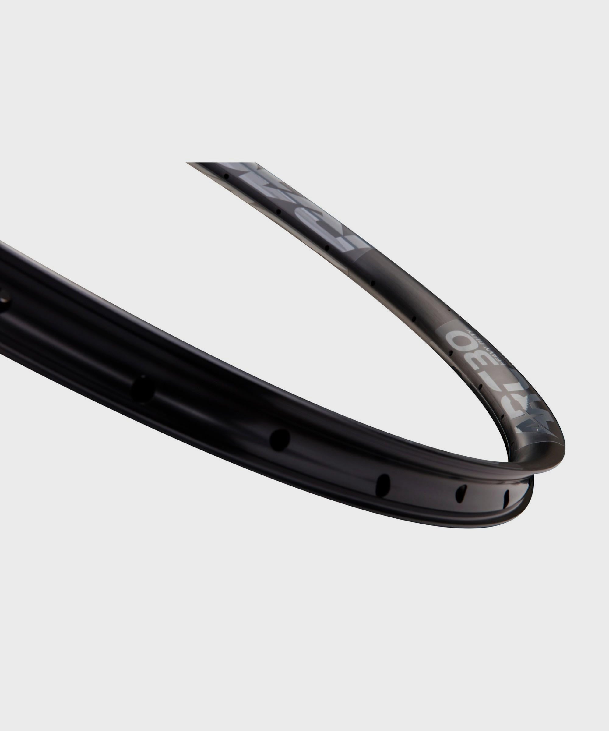 Race Face Arc heavy-duty mountain bike rim, tubeless-ready, 27.5 and 29-inch sizes, durable components for off-road cycling.