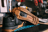 Shimano MT001 MTB SPD cleats with multi-entry design for mountain, gravel, and cyclocross pedals on a cycling shoe.