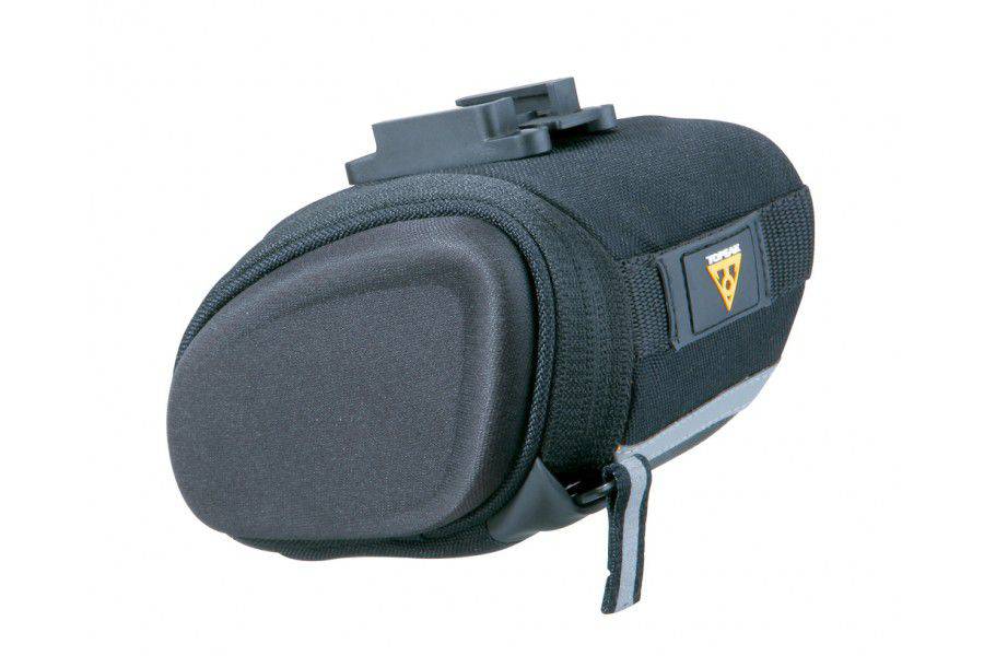 Topeak Sidekick Wedge Pack bike seat bag with semi-rigid design and reflective strip, mounted on bike saddle.