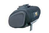 Topeak Sidekick Wedge Pack bike seat bag with semi-rigid design and reflective strip, mounted on bike saddle.