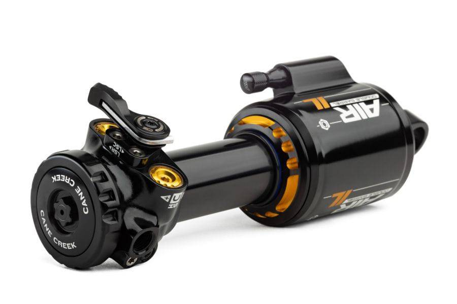 Cane Creek DB Air IL Trunnion rear shock suspension damper with LinEair spring technology, showing the shock absorber and mounting hardware.