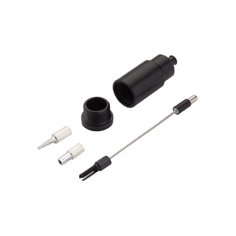 Jagwire Pro Internal Routing Tool with magnetic adapters for bike cable installation, shown in a workshop setting.