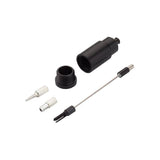 Jagwire Pro Internal Routing Tool with magnetic adapters for bike cable installation, shown in a workshop setting.
