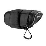 Lezyne Micro Caddy bike seat pack attached to bicycle saddle, compact and durable storage for essentials on cycling trips