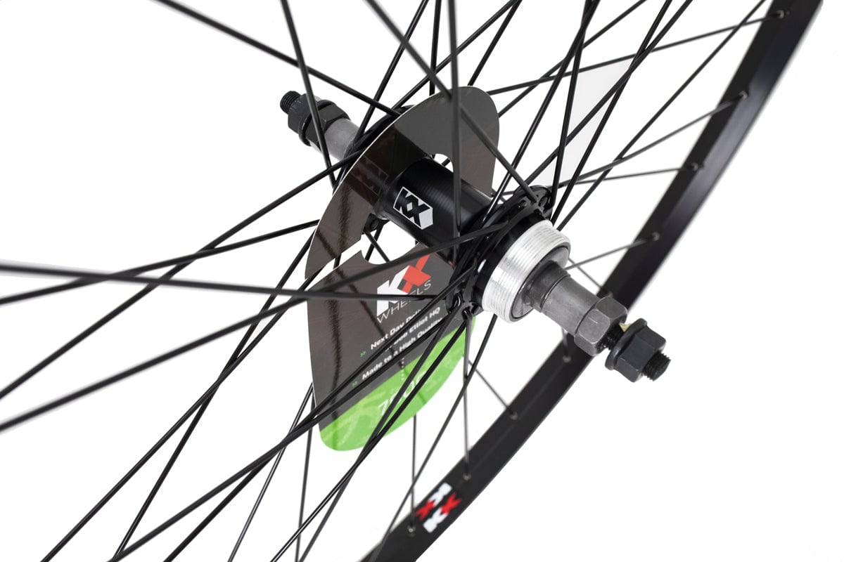 KX Wheels KX Hybrid 700C rear wheel with singlewall rim, solid axle, and rim brake compatibility for bicycle components.