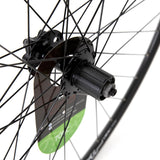 KX Wheels KX Road 700C rear wheel with 36-hole black double-wall rim, cassette, disc brake, quick release, and hub components.