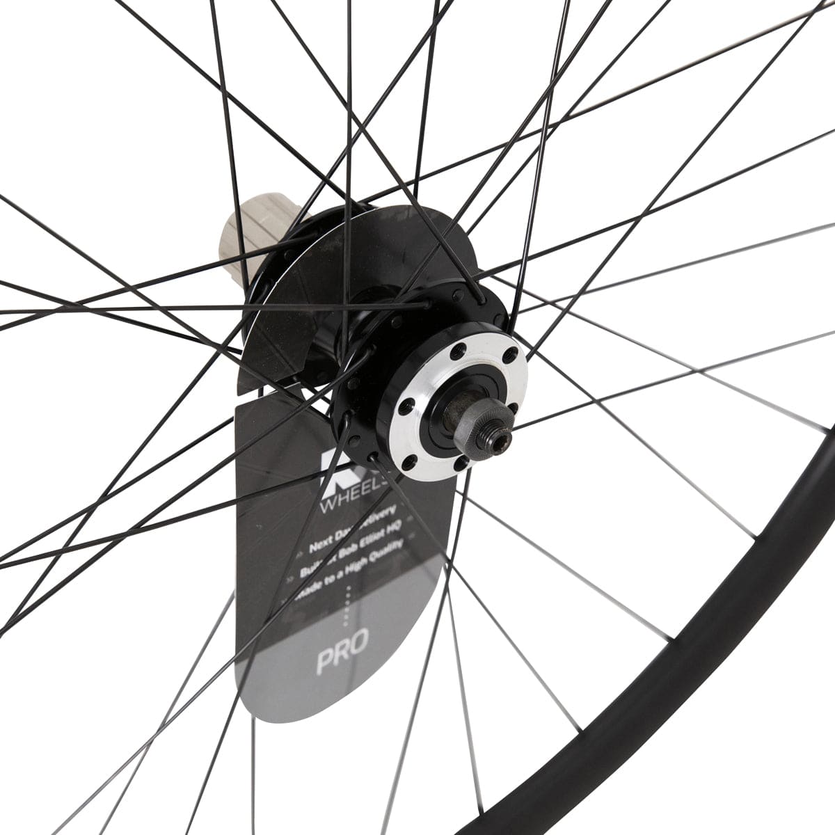 KX Wheels KX Pro Road Disc Tubeless Quick Release Wheels in black with accessories, mounted on a 700c road bike.