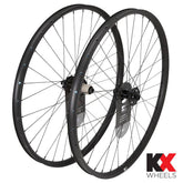 KX Wheels KX Pro 27.5-inch MTB tubeless thru axle disc wheels in black with 6-bolt brake compatibility, mounted on a bike.