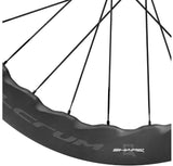 Fulcrum Sharq 57 Carbon tubeless disc brake road wheelset with Shimano HG11 compatibility, featuring sleek black carbon rims and disc brakes.