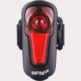 Infini Metis rechargeable rear light with automatic brake light function, mounted on a bicycle, showcasing its compact design and LED lights.