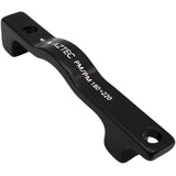 Aztec PM7 post mount adapter for 180mm frame and fork, with 220mm rotor, shown mounted on bicycle component.