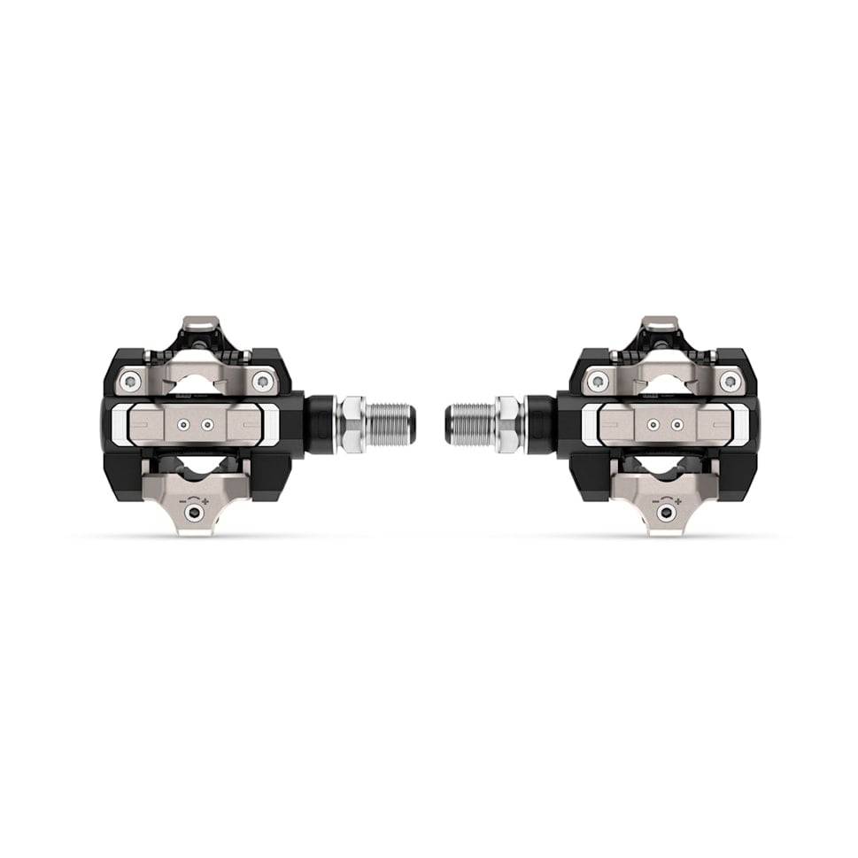 Garmin Rally XC110 single-sensing power meter pedals with Shimano SPD compatibility, showing pedal and cleat connection.