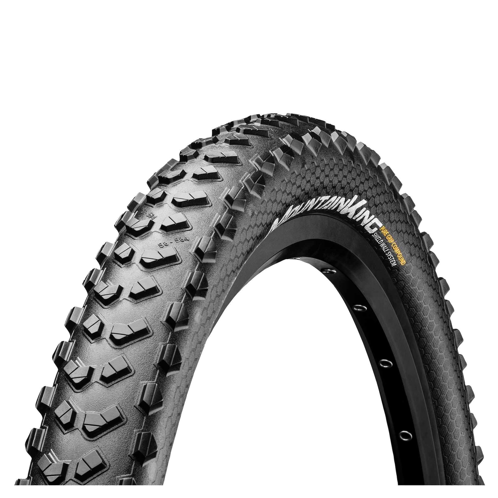 Continental Mountain King Shieldwall foldable mountain bike tyre with Puregrip compound for trail riding, shown in close-up detail.