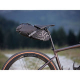 Campagnolo EKAR gravel bike waterproof saddle bag with multiple compartments and secure straps for bikepacking accessories.