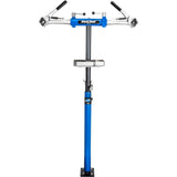 Park Tool PRS-2.4-1 Deluxe double arm bike repair stand with 100-3C clamps for workshop bike maintenance and repair.