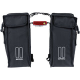 Black Basil distance holder for double panniers with rear light mount, accessory for bike racks and luggage carriers.