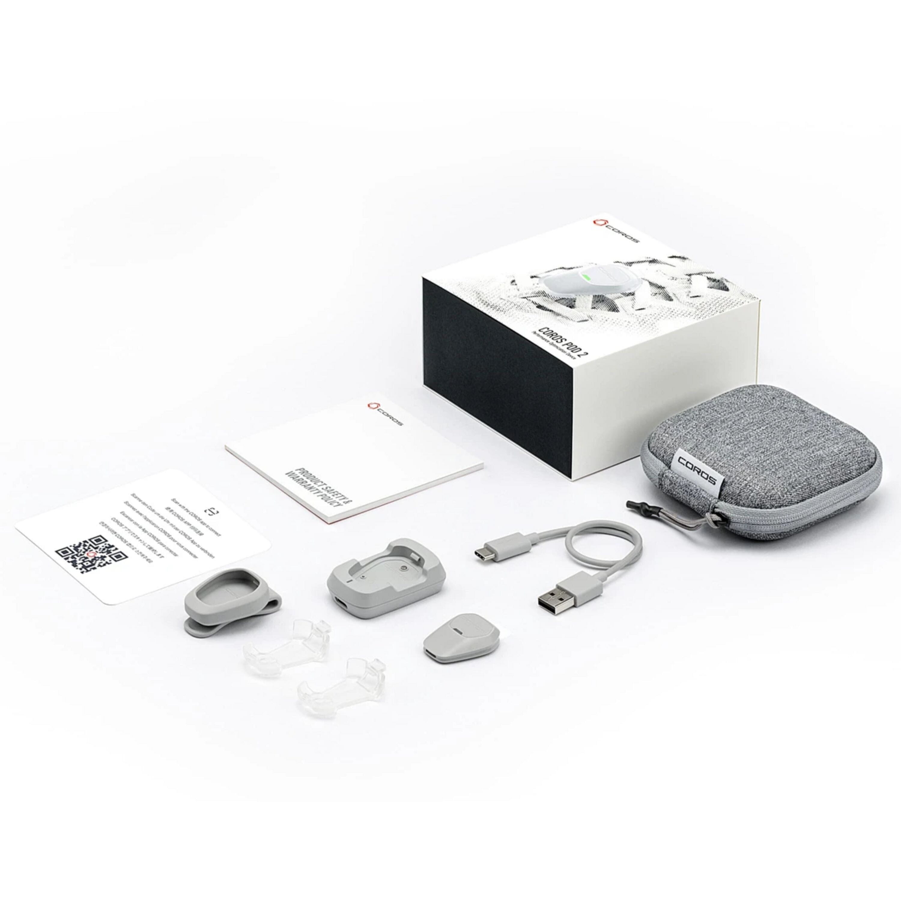 Coros POD 2 running sensor with real-time pace and running form metrics, shown inside its box with accessories.