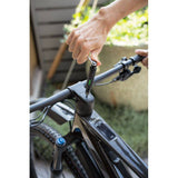 Topeak E-Torqbar digital torque wrench with LED indicator, black, shown on workshop surface, used for precise torque adjustments.