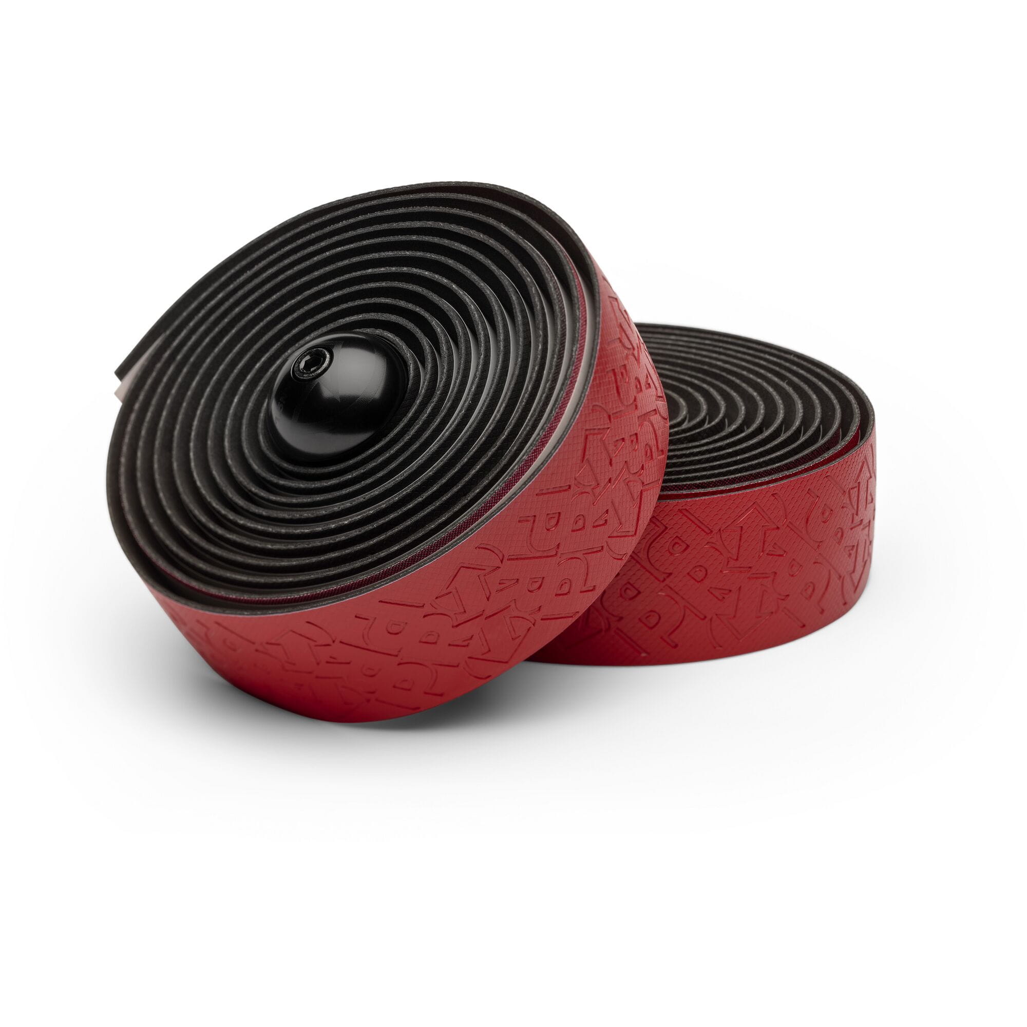 PRO Pursuit Team handlebar tape with gel backing and alloy end caps for cycling, shown on a bicycle handlebar.