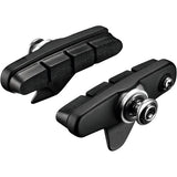 Shimano 105 R55C4 cartridge brake shoes for alloy rim calipers, pair of components for bike braking system.