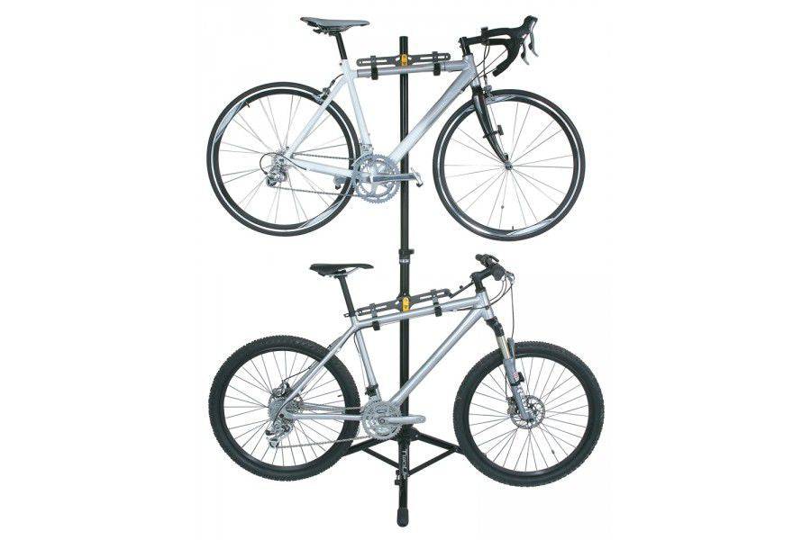 Topeak Two Up bike stand in black, portable 4-bike storage and repair rack with sturdy metal frame and multiple bike slots.
