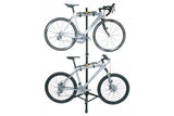 Topeak Two Up bike stand in black, portable 4-bike storage and repair rack with sturdy metal frame and multiple bike slots.