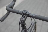 Quad Lock adjustable stem cap mount for secure smartphone bike mounting on bike handlebars.