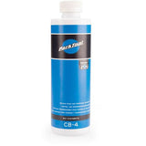 Park Tool CB-4 Bio Chainbrite bicycle chain degreaser in a workshop setting, showing the eco-friendly chain cleaning product.