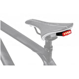 Topeak Redlite 30 black USB rechargeable rear bike light with 30 lumens, waterproof IPX6, mounted on a bicycle.