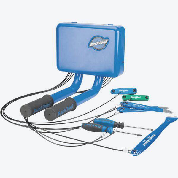 Park Tool THS-1.2 Trailhead Workstation outdoor bike repair station with tools and workshop setup for bike maintenance.