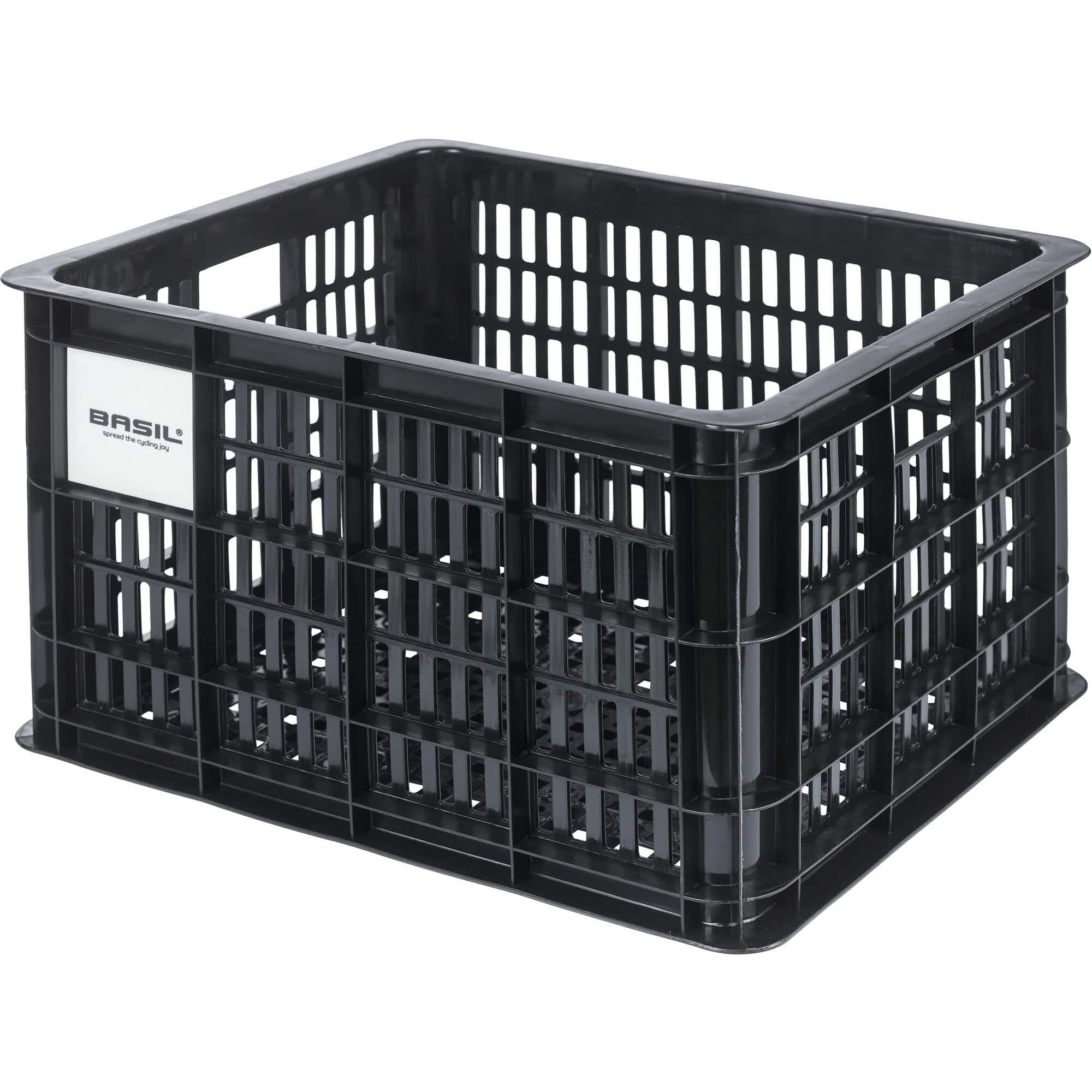Basil Medium 29.5L black recycled synthetic bicycle crate for bike accessories, mounted on a bike for carrying essentials