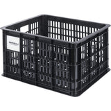 Basil Medium 29.5L black recycled synthetic bicycle crate for bike accessories, mounted on a bike for carrying essentials