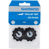 Shimano GRX RD-RX400 rear derailleur pulley set for gravel bike components, genuine replacement parts with metal and plastic pulleys.
