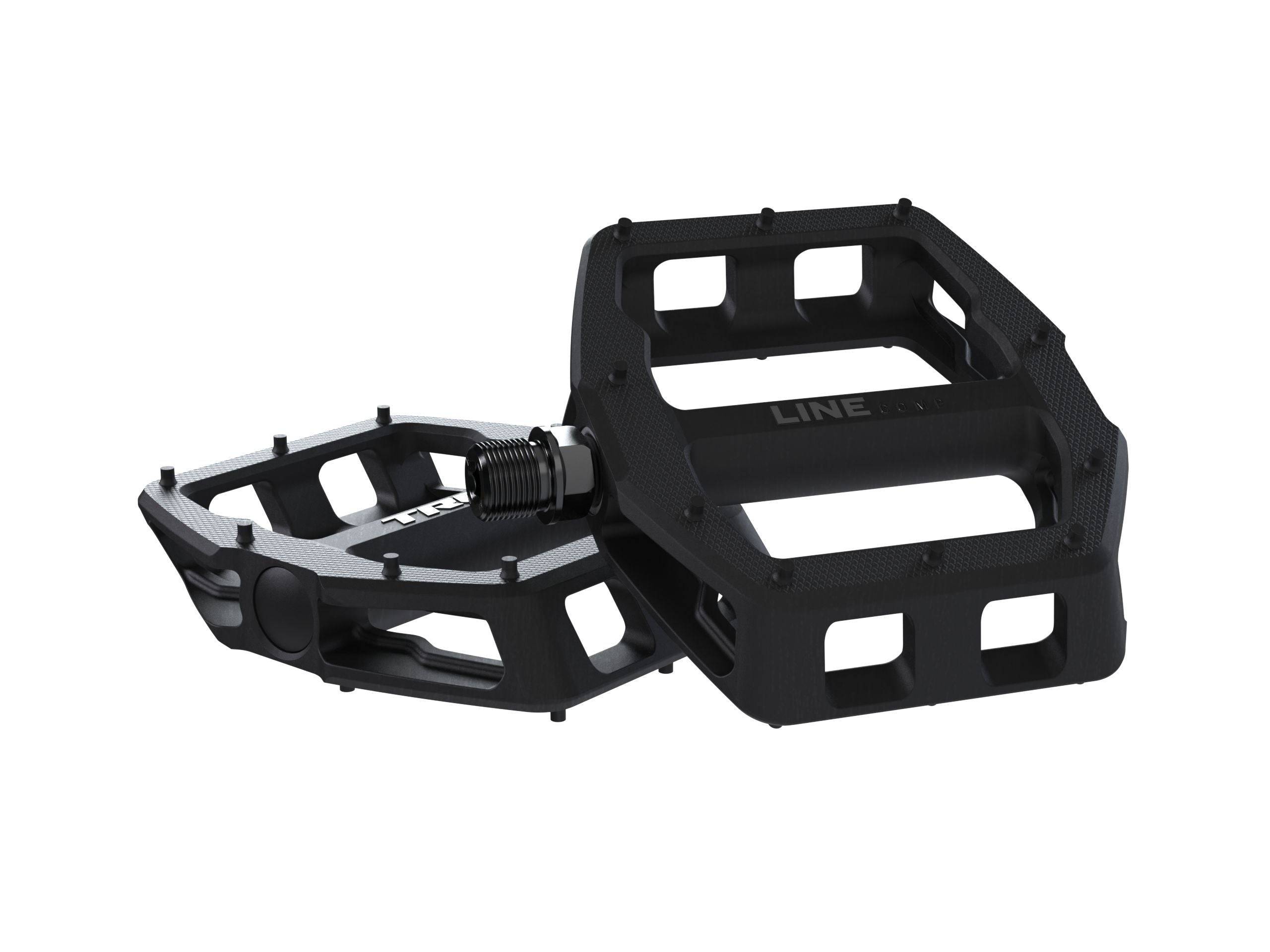 Trek Line Comp flat bike pedals with durable design and superior grip, featuring metal pins for stability and control.