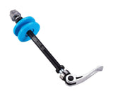 BBB Tool ChainGrip chain tensioner for 130mm road and 135mm MTB bikes, shown installed in a workshop setting
