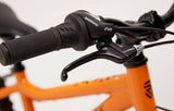 Ridgeback MX20 kids bike with Suntour fork, suitable for ages 6-10, riders 120-140cm, black frame and training wheels.