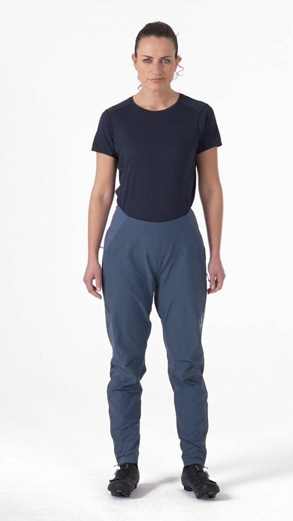 Rab Cinder Crank women's cycling softshell pants, durable and breathable outdoor trousers shown on a model.