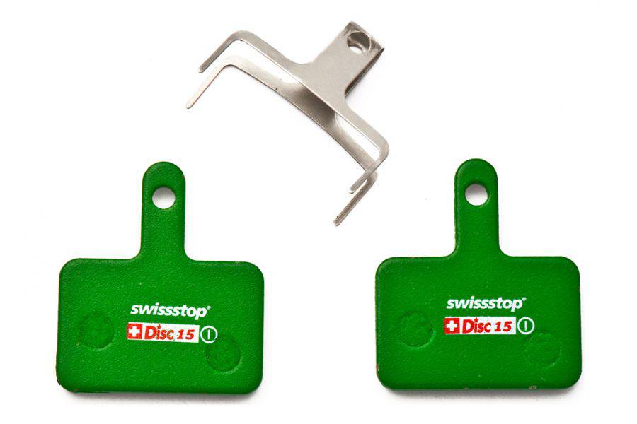 Set of SwissStop green disc brake pads for Shimano M5, T6, M3 bikes, showing the brake pad components in the image.