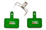 Set of SwissStop green disc brake pads for Shimano M5, T6, M3 bikes, showing the brake pad components in the image.