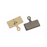 Jagwire Pro semi-metallic disc brake pads for Shimano and RideRever Cargo-D mountain bike brakes, showing detailed brake pad components.