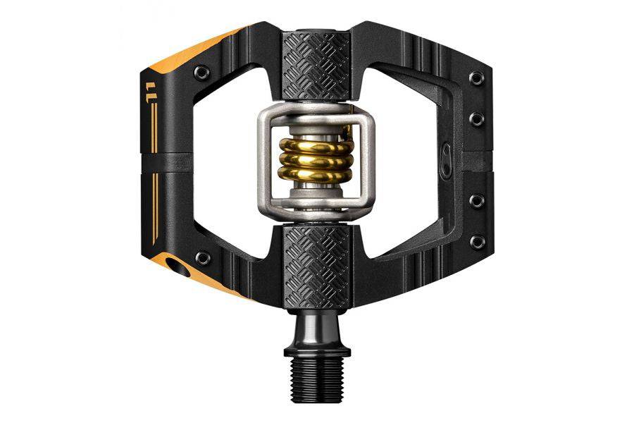 Crankbrothers Mallet E 11 enduro pedals in black and gold with adjustable pins, durable bike component for mountain biking.