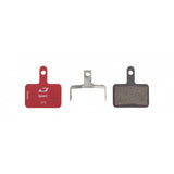 Jagwire Sport semi-metallic disc brake pads for Shimano and Promax systems, shown in red for high-performance bike braking.