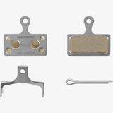 Shimano G04Ti-MX metal sintered disc brake pads with titanium back and spring for mountain bike braking components.