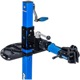 Park Tool 104-30 workshop work tray attached to PRS-30 manual lift stand, used as a tool organizer in a workshop setting.