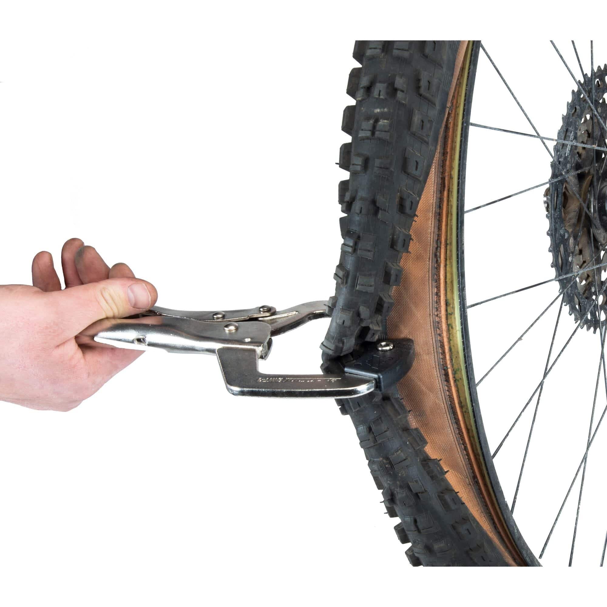 Park Tool BMT-1 bicycle tyre bead breaker in a workshop setting, designed for tubeless and tight-fit bike tires.