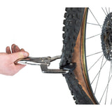 Park Tool BMT-1 bicycle tyre bead breaker in a workshop setting, designed for tubeless and tight-fit bike tires.