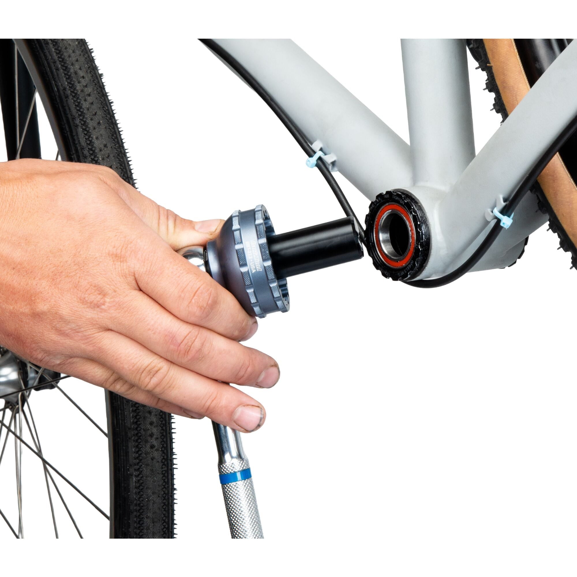Park Tool GPS-24 guide pin for Shimano 24mm axle bottom bracket tools, shown in a workshop setting with the tool in focus.