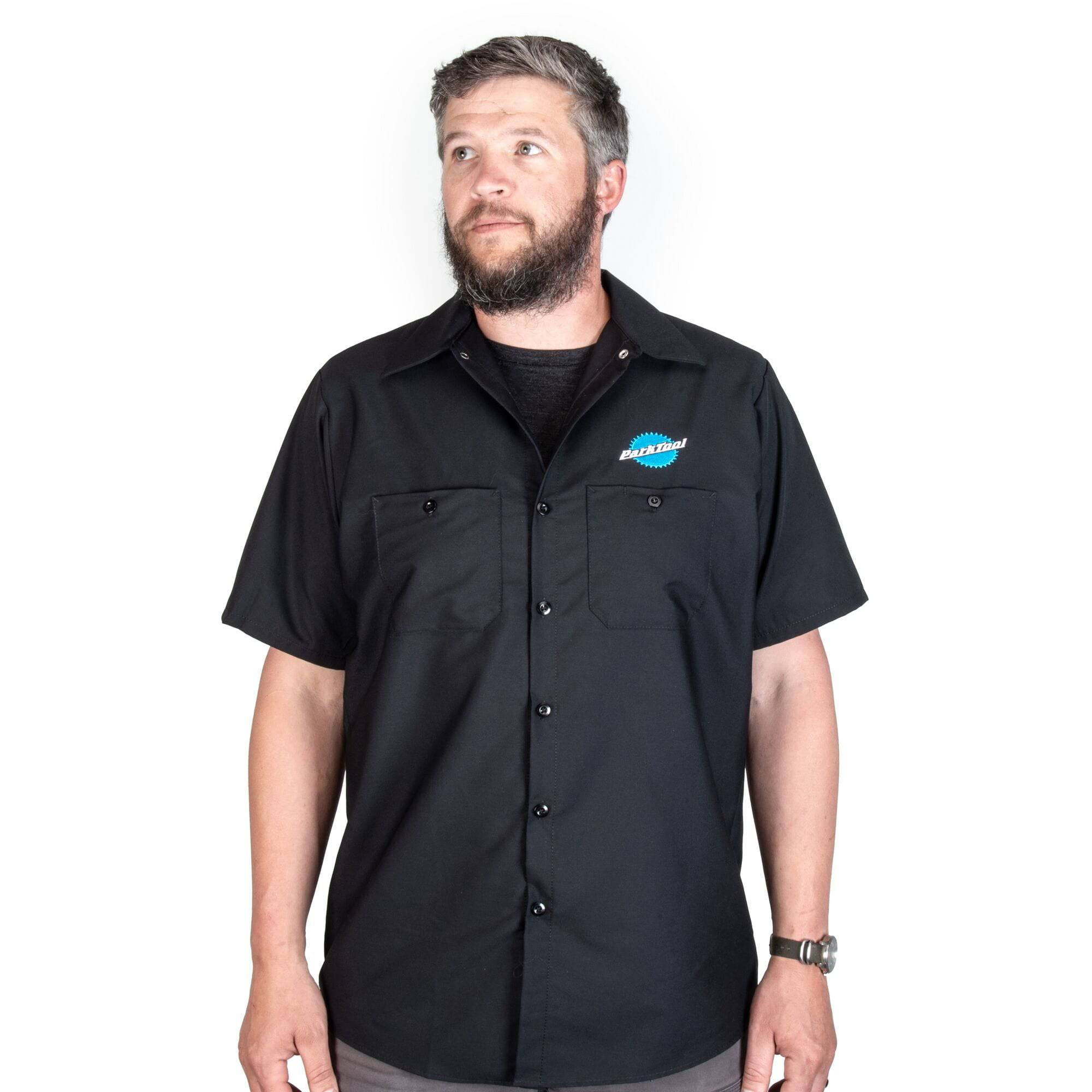 Park Tool MS-3 mechanics workshop shirt in XXL with tool pockets and embroidered logo, displayed on a hanger.
