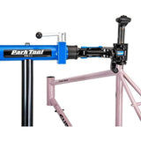 Park Tool PRS-2.4-2 Deluxe double arm bike repair stand with 100-3D clamps, sturdy workshop bike maintenance equipment.