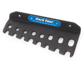 Park Tool T-Handle Hex Wrench Holder mounted on wall, designed for organizing THH-1 hex wrenches in a workshop setting.